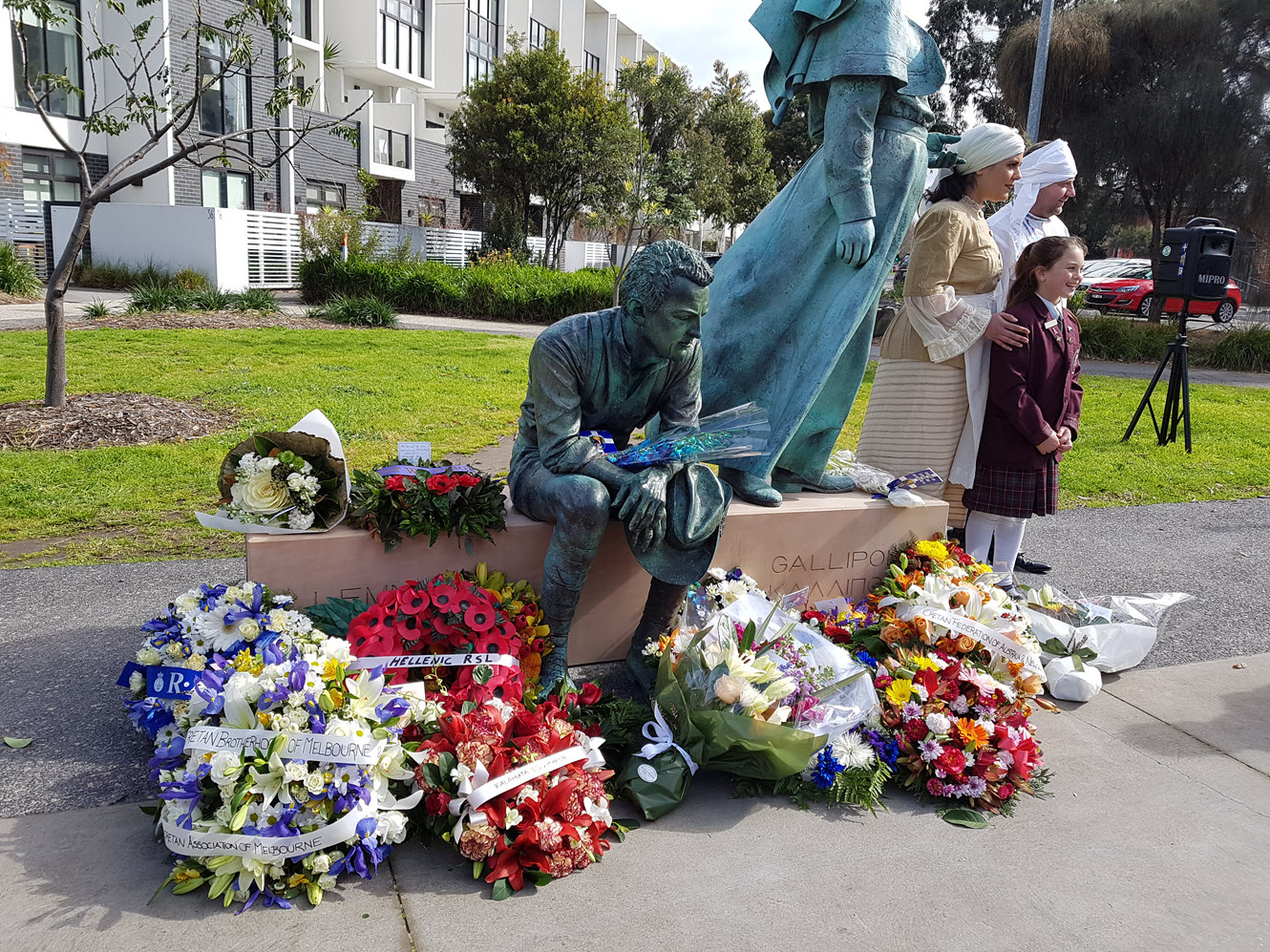 Wreaths laid at the foot of the memorial